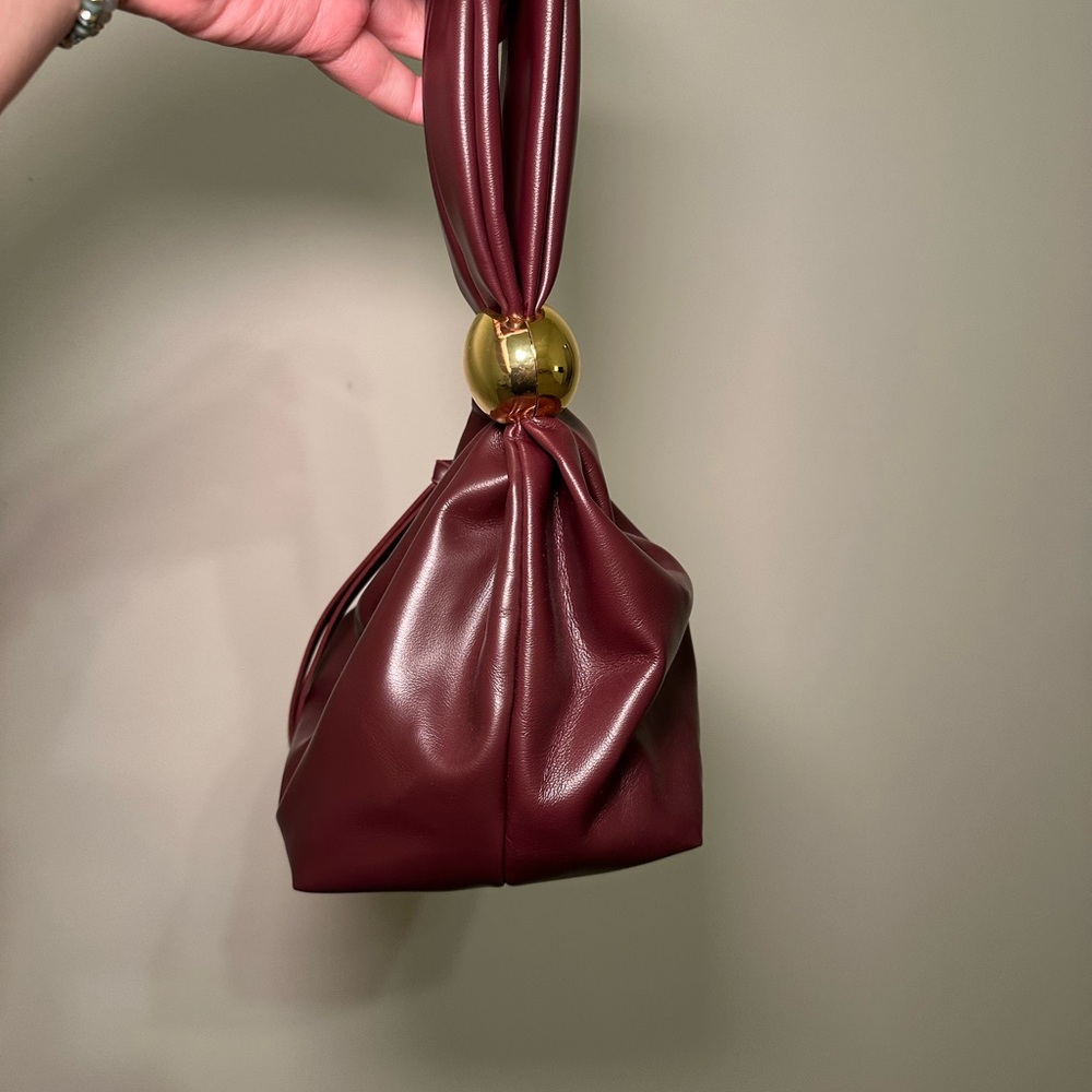 Elegant Burgundy Clutch with Gold Detail - Picture 2 of 3